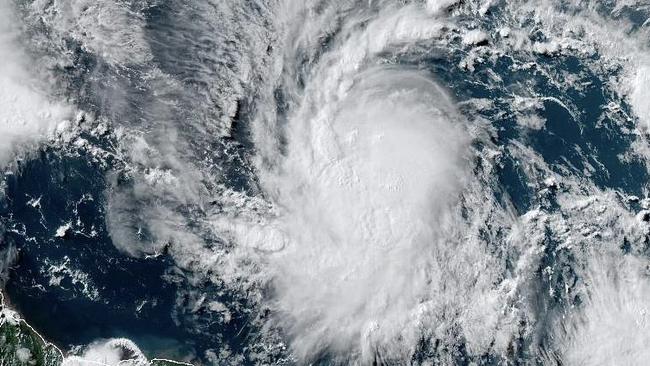 This National Oceanic and Atmospheric Administration (NOAA)/GOES satellite handout image shows Tropical Storm Beryl at 19:30UTC on June 29, 2024. Much of the southeast Caribbean went on alert Saturday as Tropical Storm Beryl was set to undergo rapid strengthening, becoming a "dangerous" major hurricane before it crosses the Windward Islands sometimes on June 30, forecasters said. Barbados, St Lucia, St Vincent and the Grenadines and Grenada all had hurricane watches in place, the US National Hurricane Center said, as Beryl swirled in the Atlantic. (Photo by HANDOUT / NOAA/GOES / AFP) / RESTRICTED TO EDITORIAL USE - MANDATORY CREDIT "AFP PHOTO /NOAA/GOES" - NO MARKETING NO ADVERTISING CAMPAIGNS - DISTRIBUTED AS A SERVICE TO CLIENTS