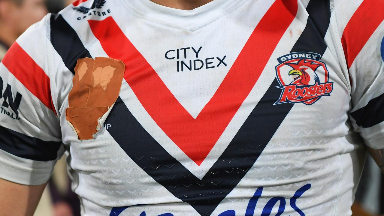 Players to cover NRL logo on shirts as pay dispute escalates, NRL