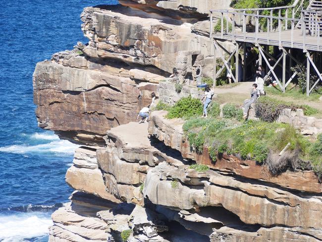 Tourists are risking their lives for social media likes after what Diamond Bay residents say is an influx of people descending on their exclusive suburb, trashing it with human waste, in recent weeks.