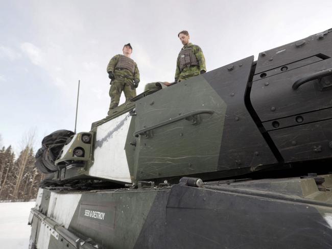 Soldiers stand on a Leopard 2 tanks that are being supplied to Ukraine by several European nations. Picture: AFP