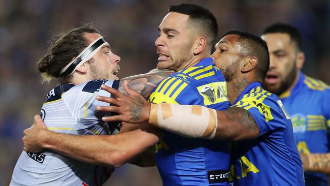 Ethan Lowe is met by Corey Norman and the Eels defence.