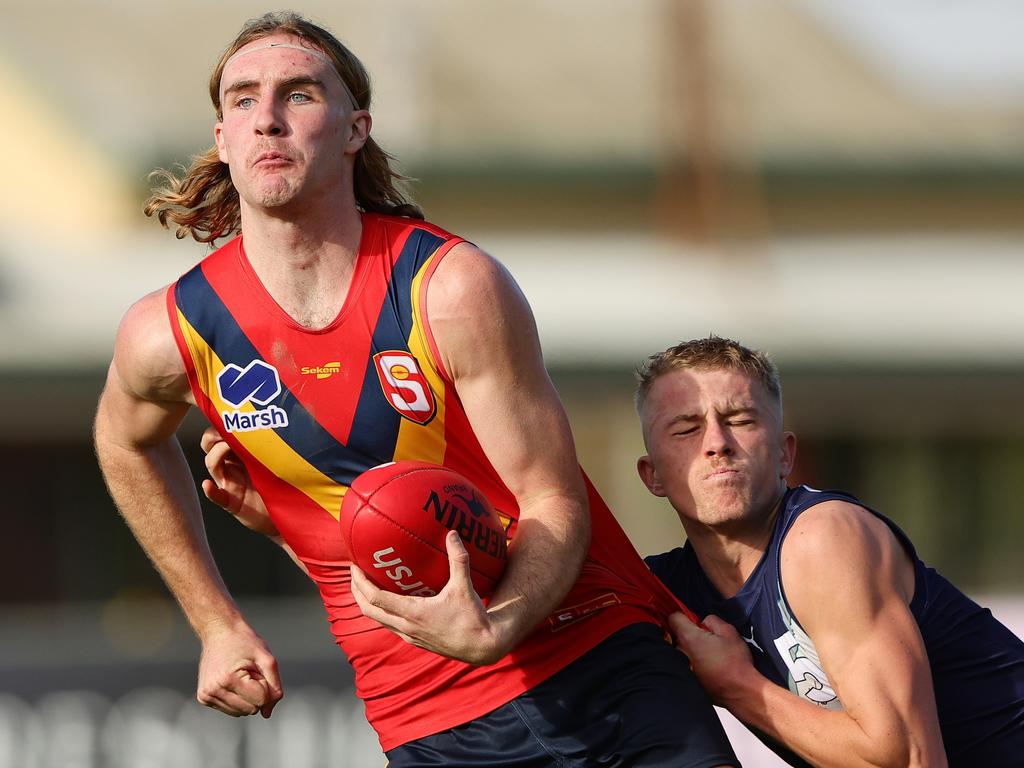 Dyson Sharp tries to get clear. Picture: Sarah Reed/AFL Photos