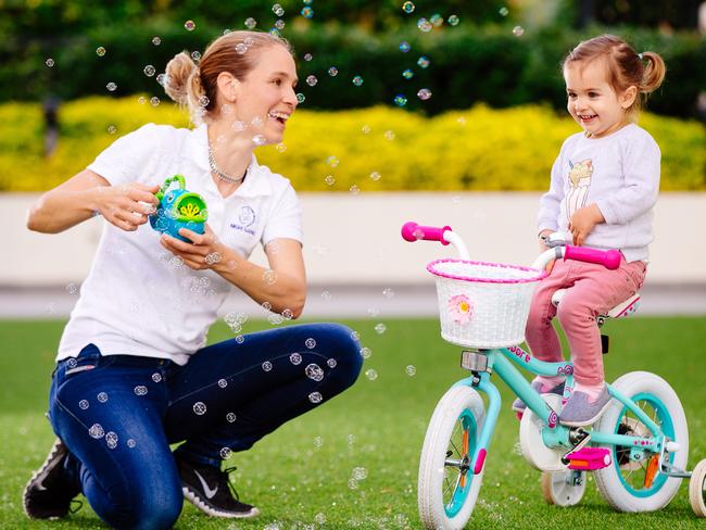 Nanny Frederike Klaar takes a break from training to play with 23-month-old Pauline at her Northmead home. Picture: Jonathan Ng