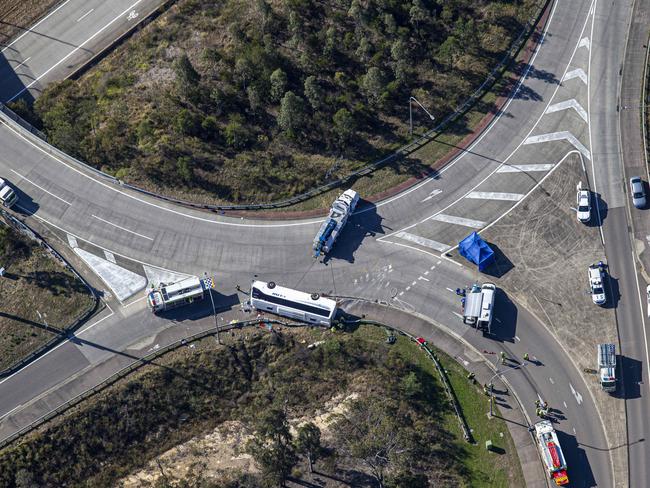 **ATTENTION EDITORS: Image contains graphic content** **BODY IS BLURRED FOR WEB**HUNTER VALLEY, AUSTRALIA - NCA NewsWire Photos - 12 JUNE, 2023: Aerial scene coverage from the site where ten people have died, and 11 people were hospitalised after a bus carrying wedding guests crashed in the Hunter Valley., Picture: NCA NewsWire / Christian Gilles