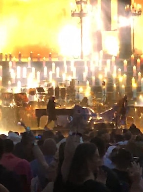 Elton John walks off the stage during the freak storm.