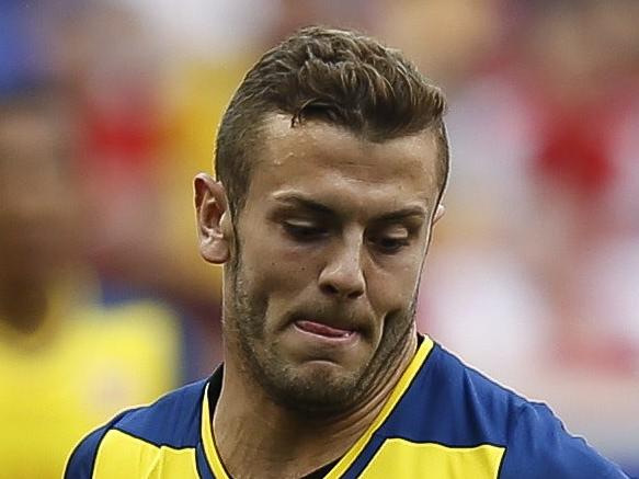 HARRISON, NJ - JULY 26: Jack Wilshere #10 of Arsenal fights for the ball with Ambroise Oyongo #3 and Tim Cahill #17 of New York Red Bulls during their friendly match at Red Bull Arena on July 26, 2014 in Harrison, NJ. Jeff Zelevansky/Getty Images/AFP == FOR NEWSPAPERS, INTERNET, TELCOS & TELEVISION USE ONLY ==