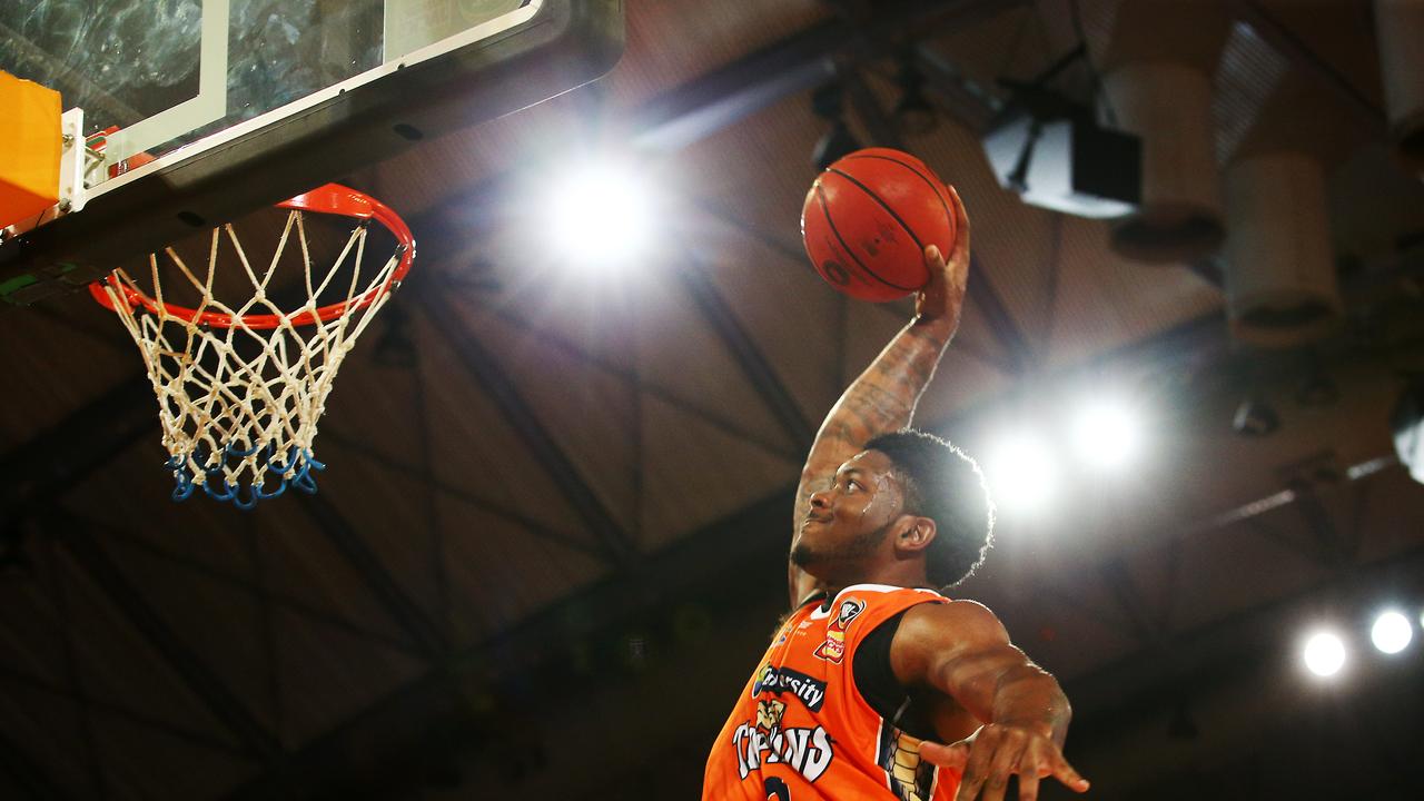 Cameron Oliver slam dunks the ball in the National Basketball League (NBL) match between the Cairns Taipans and the Adelaide 36ers, held at the Cairns Convention Centre. PICTURE: BRENDAN RADKE