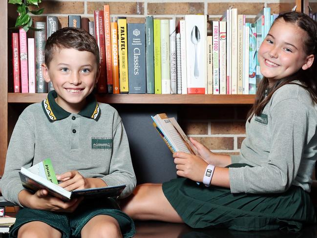 DAILY TELEGRAPH - Pictured is Hugo 7 and Nadia Hammond 10, reading books at home in Alexandria today. Picture: Tim Hunter.