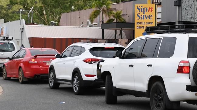 Cars line up outside an Alice Springs bottle shop last week. Picture: Mark Brake