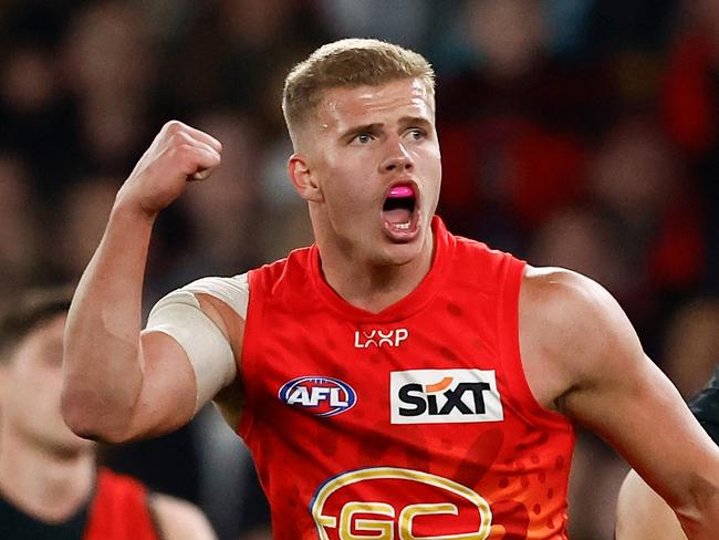 MELBOURNE, AUSTRALIA - AUGUST 10: Jed Walter of the Suns celebrates a goal during the 2024 AFL Round 22 match between the Essendon Bombers and the Gold Coast SUNS at Marvel Stadium on August 10, 2024 in Melbourne, Australia. (Photo by Michael Willson/AFL Photos via Getty Images)