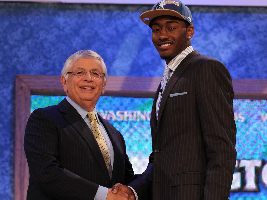 John Wall, in 2010, with then-NBA commissioner David Stern, after being unveiled as the No.1 pick in the draft. Picture: Getty Images/AFP