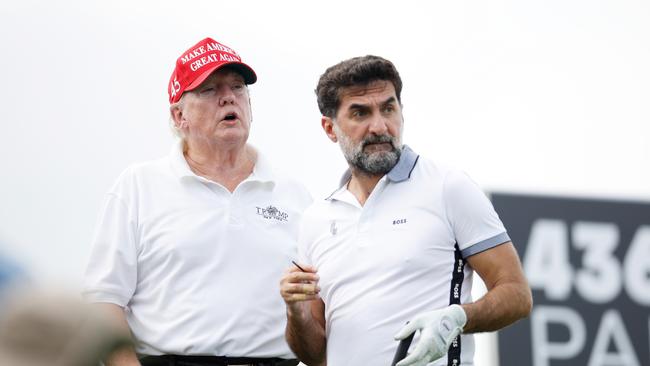 Trump and Yasir al-Rumayyan, head of the sovereign wealth fund of Saudi Arabia. Cliff Hawkins/Getty Images/AFP