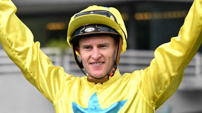 Lucky Sweynesse ridden by Zac Purton celebrates winning the Group 1 Sprint race during the Hong Kong International Races at Sha Tin Racecourse in Hong Kong on December 10, 2023. (Photo by Peter PARKS / AFP)