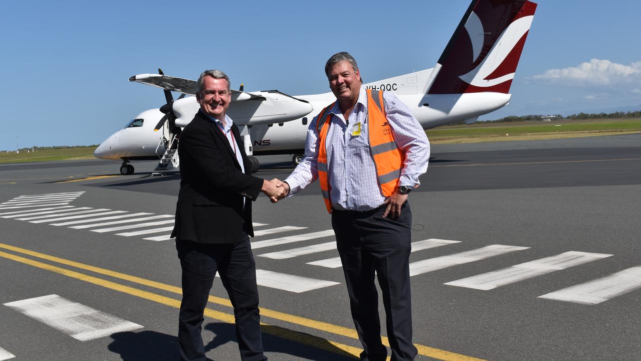 Skytrans CEO Alan Milne and Whitsunday Mayor Andrew Willcox celebrate the arrival of Skytrans' first Cairns to Proserpine flight on September 13, 2021. Picture: Kirra Grimes