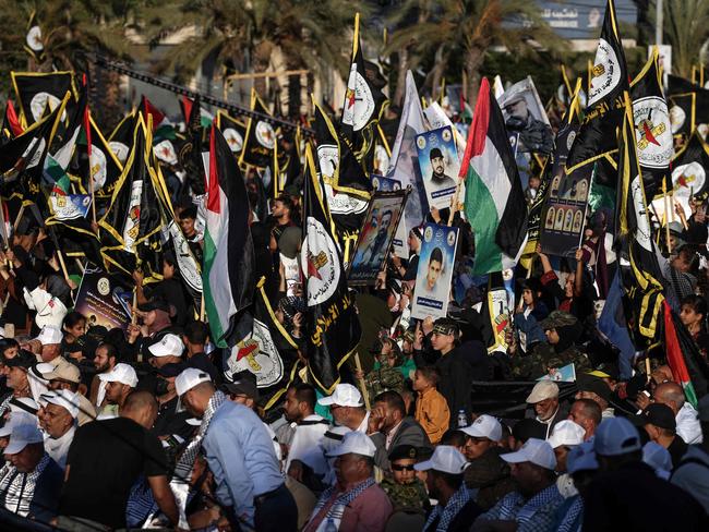 Supporters of the Palestinian Islamic Jihad carry flags as they take part in a rally marking the 36th anniversary of the movement's foundation, in Gaza City. Picture: AFP