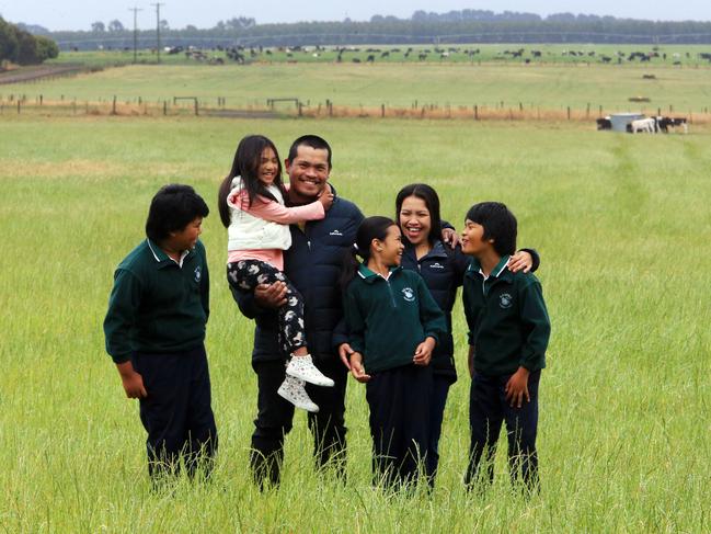 13/12/18 Skilled migrant Bellmar Deloso with his wife Anna and their children (L-R) Clifford (11), Megan (5), Pab (9) and Lennon (10) from the Phillipines at Aalanvale Dairy near Woolsthorpe, 300km west of Melbourne. Aaron Francis/The Australian