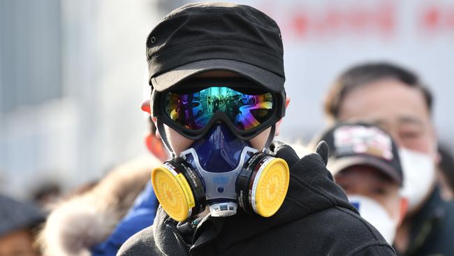 Is this really necessary? The Australian government advises people do not need to wear face masks if they are well. Picture: AFP