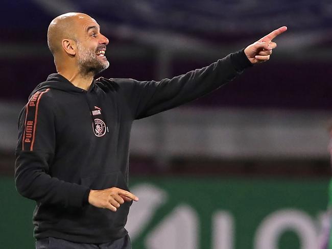 Manchester City's Spanish manager Pep Guardiola gestures on the touchline during the English League Cup fourth round football match between Burnley and Manchester City at Turf Moor in Burnley, north west England on September 30, 2020. (Photo by MOLLY DARLINGTON / POOL / AFP) / RESTRICTED TO EDITORIAL USE. No use with unauthorized audio, video, data, fixture lists, club/league logos or 'live' services. Online in-match use limited to 120 images. An additional 40 images may be used in extra time. No video emulation. Social media in-match use limited to 120 images. An additional 40 images may be used in extra time. No use in betting publications, games or single club/league/player publications. /