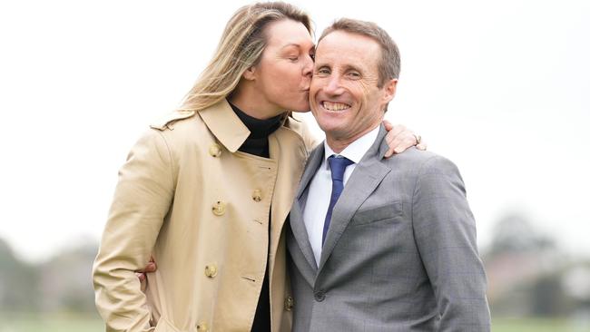 Damien Oliver is kissed by his wife Trish Oliver during a Damien Oliver Media Call where he announced he will retire in December at Ladbrokes Park Hillside Racecourse on August 30, 2023 in Springvale, Australia. (Photo by Scott Barbour/Racing Photos via Getty Images)