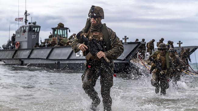 US Marines disembark a landing craft on King's Beach near Bowen, Queensland, during Exercise Talisman Sabre.