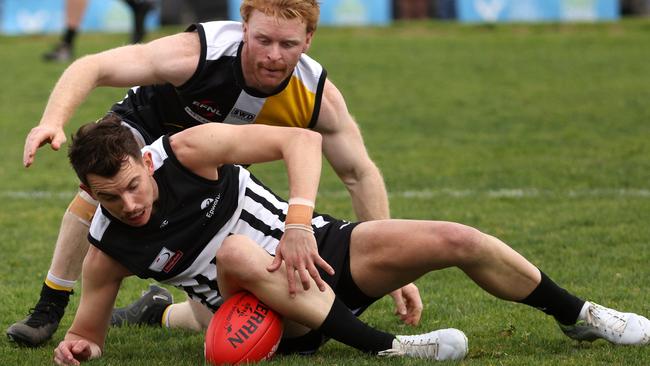 EFL: Zachary Tempany of Surrey Park protects the ball from Chirnside Park’s Lachlan Mcgee. Photo: Hamish Blair