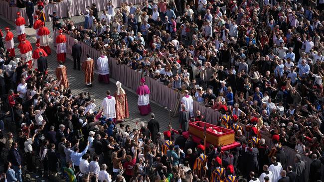 Crowds look on as the body of Pope Francis is transferred to the Basilica at St Peter’s Square on April 23, 2025 in Vatican City, Vatican. Picture: Getty