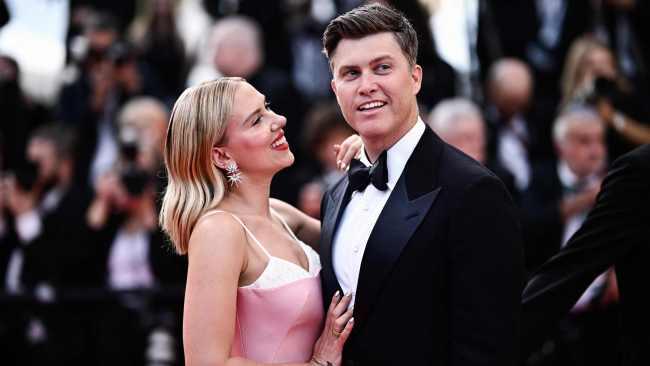 TOPSHOT - US actress Scarlett Johansson (L) and US comedian Colin Jost (L) arrive for the screening of the film "Asteroid City" during the 76th edition of the Cannes Film Festival in Cannes, southern France, on May 23, 2023. (Photo by LOIC VENANCE / AFP)