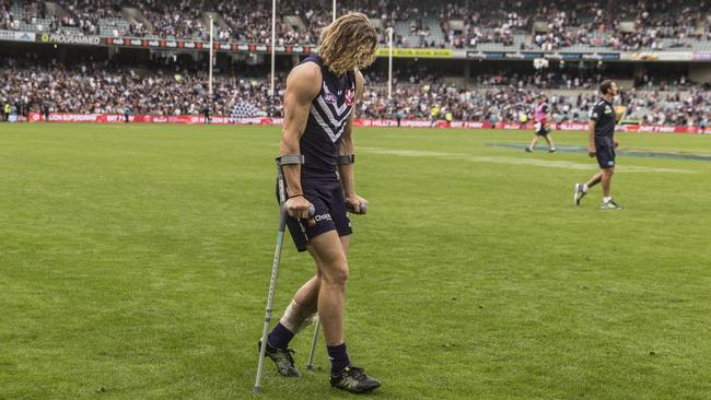 Nat Fyfe hobbles off Subiaco after injuring his leg against Carlton.