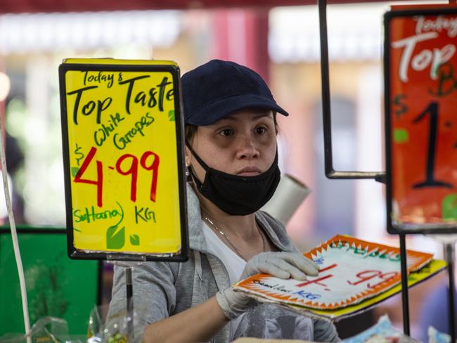 MELBOURNE, AUSTRALIA - NewsWire Photos OCTOBER 29, 2020: Today the Queen Victoria Market's  specialty retail shops and stalls, cafes and restaurants will reopen, welcoming Melburnians back to Melbourne's iconic marketplace. Wearing a mask incorrectly by mainly stall holders who were not eating or drinking was witnessed among a significant amount of stall holders. Picture: NCA NewsWire / Sarah Matray