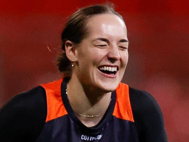 SYDNEY, AUSTRALIA - AUGUST 11: Isabel Huntington of the Giants shares a joke during the GWS Giants AFLW training session at Giants Stadium on August 11, 2022 in Sydney, Australia. (Photo by Michael Willson/AFL Photos via Getty Images)