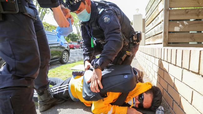 The lockdown protest changed locations from the CBD to the streets and beaches of Elwood. Picture: Alex Coppel.