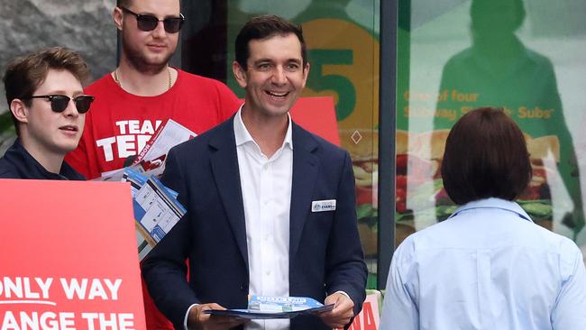 LNP's Trevor Evans handing out how to vote cards at City Hall pre-polling centre, Brisbane. Picture: Liam Kidston