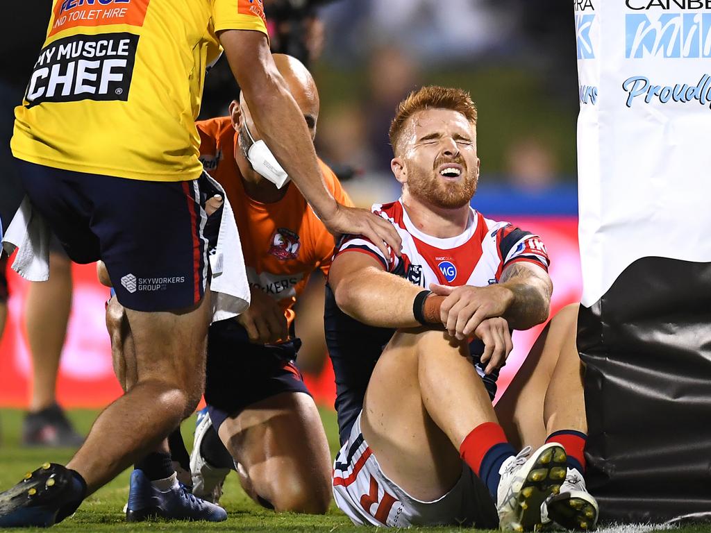 MACKAY, AUSTRALIA - SEPTEMBER 02: Adam Keighran of the Roosters reacts after clashing with a goal post before scoring a try during the round 25 NRL match between the Canberra Raiders and the Sydney Roosters at BB Print Stadium, on September 02, 2021, in Mackay, Australia. (Photo by Albert Perez/Getty Images)