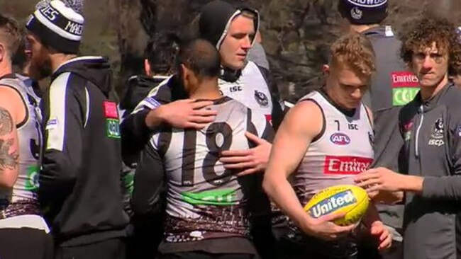 Travis Varcoe is comforted by teammates at Collingwood training this week. Picture: Nine News