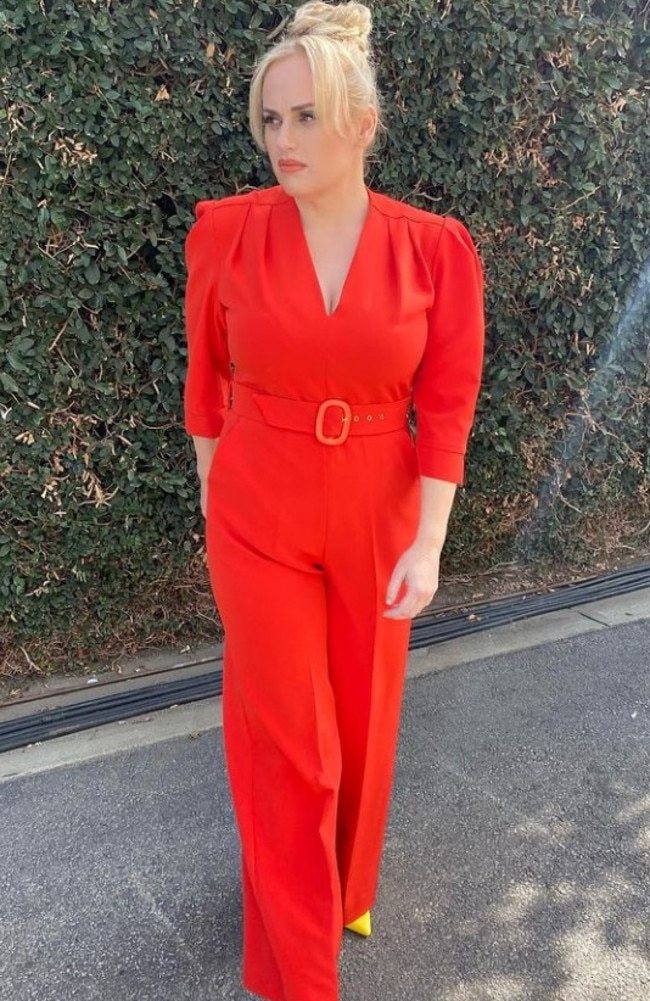 Newly single Rebel poses in this bold red jumpsuit. Picture: rebelwilson/Instagram