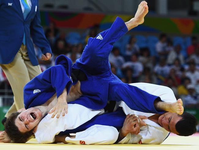 Josh Katz (blue) took on one of the world’s best judokas, Diyorbek Urozboev of Uzbekistan, in his Olympics debut. Picture: Getty Images