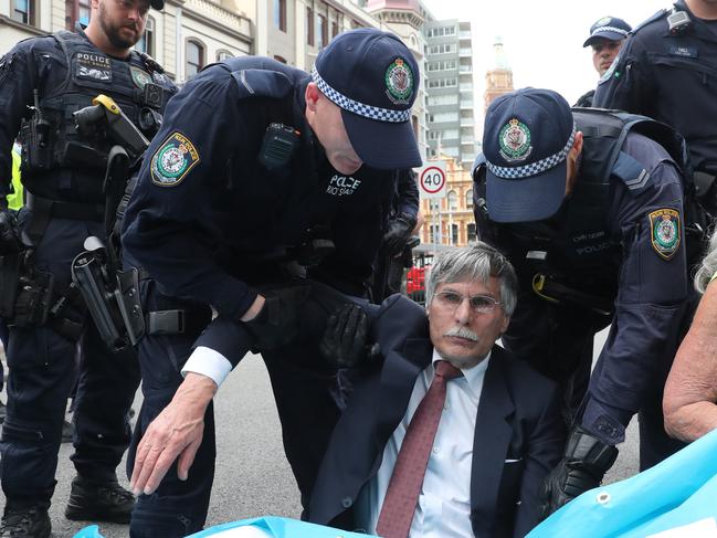 Environmental scientist and University of Western Sydney lecturer Martin Wolterding is approached by police. Picture: Richard Dobson