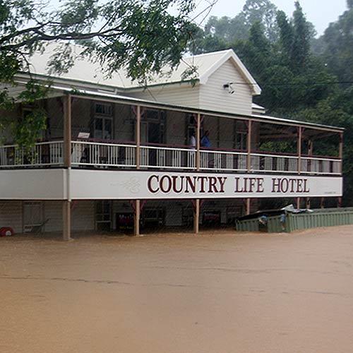 Kin Kin recovers after the floods. Country Life Hotel employee Shelley Lait (left) and resident Joanne Jowatt in the pub that was devastated by the recent floods. Photo:Geoff Potter/n22032