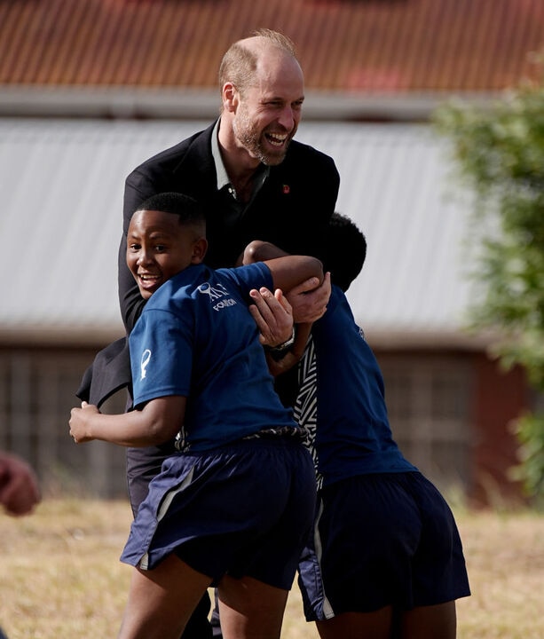 Prince William hits footy field with South African kids