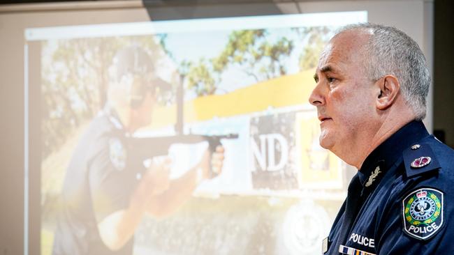 Peter Harvey in front of a screen showing the machinegun in action at a press conference on Wednesday. Picture: Mike Burton