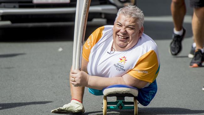 Baton Bearer John Coutis carrying the Queen’s Baton in Surfers Paradise on the last day of the relay ahead of the official start to the 2018 Gold Coast Commonwealth Games.