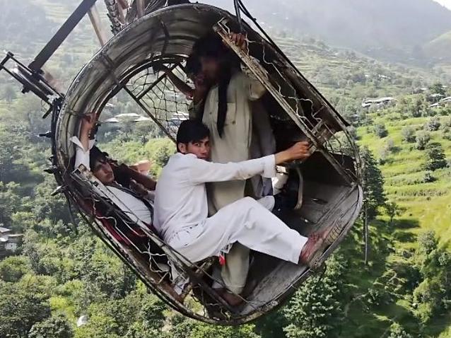 Eight people were left dangling over a ravine in Pakistan when a line on their cable car snapped in August. Two were rescued by helicopter, the rest via a makeshift chairlift after a nailbiting 16 hours. Picture: Supplied