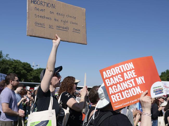 WASHINGTON, DC - MAY 17: A protester carries a sign as they attend the "Jewish Rally for Abortion Justice" rally at Union Square near the U.S. Capitol on May 17, 2022 in Washington, DC. The rally, hosted by the National Council of Jewish Women, is taking place more than two weeks since the leaked draft of the Supreme Court's potential decision to overturn Roe v. Wade.   Anna Moneymaker/Getty Images/AFP == FOR NEWSPAPERS, INTERNET, TELCOS & TELEVISION USE ONLY ==