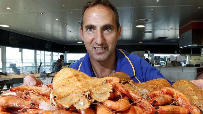 Salvi Vinaccia from Charis Seafoods, at Labrador, pictured with the popular Christmas lunch items of prawns and bugs. Photo Jerad Williams