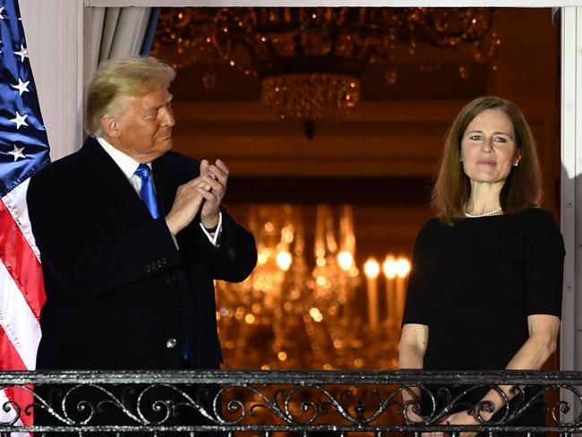 Donald Trump applauds Judge Amy Coney Barrett after she was sworn in. Picture: AFP