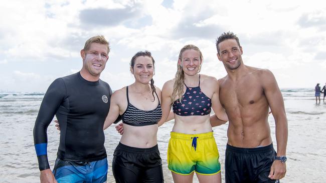 Anna Meares and Jessica Gallagher joined in the surf lesson. Picture: Jerad Williams