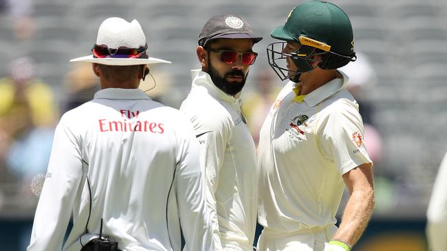 Virat Kohli and Tim Paine bump into each other during day four. Picture: Getty Images