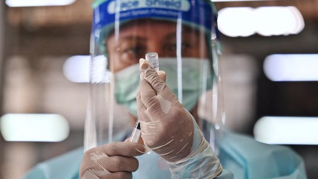 A Thai health worker administers the CoronaVac vaccine, developed by China's Sinovac firm, in Bangkok. Picture: AFP