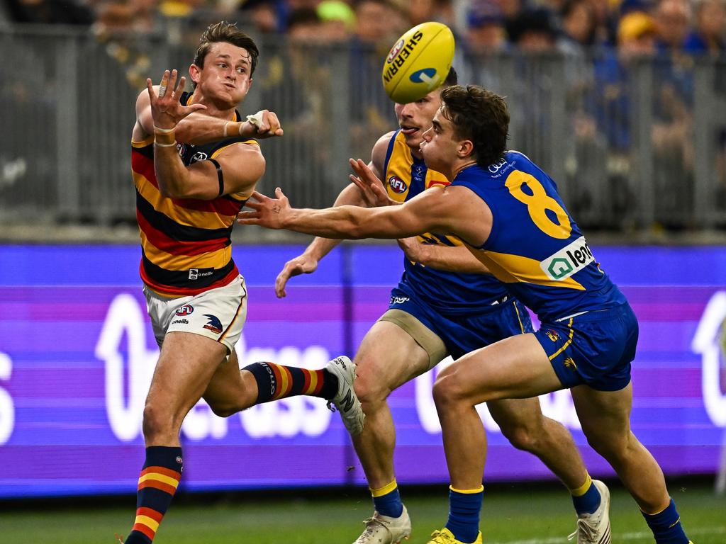 PERTH, AUSTRALIA – AUGUST 26: Matt Crouch of the Crows handpasses the ball during the 2023 AFL Round 24 match between the West Coast Eagles and the Adelaide Crows at Optus Stadium on August 26, 2023 in Perth, Australia. (Photo by Daniel Carson/AFL Photos via Getty Images)