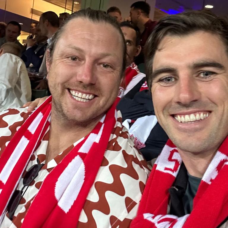 James pattinson pictured with Pat Cummins during the Swans preliminary final win over Port Adelaide in 2024.